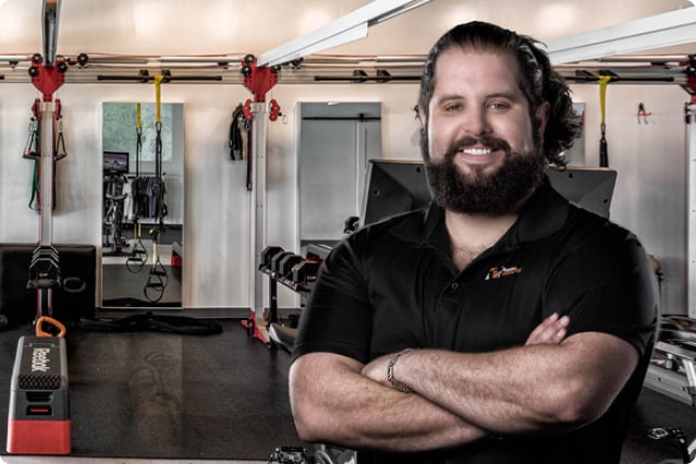 andres in front of the pledge to fitness studio