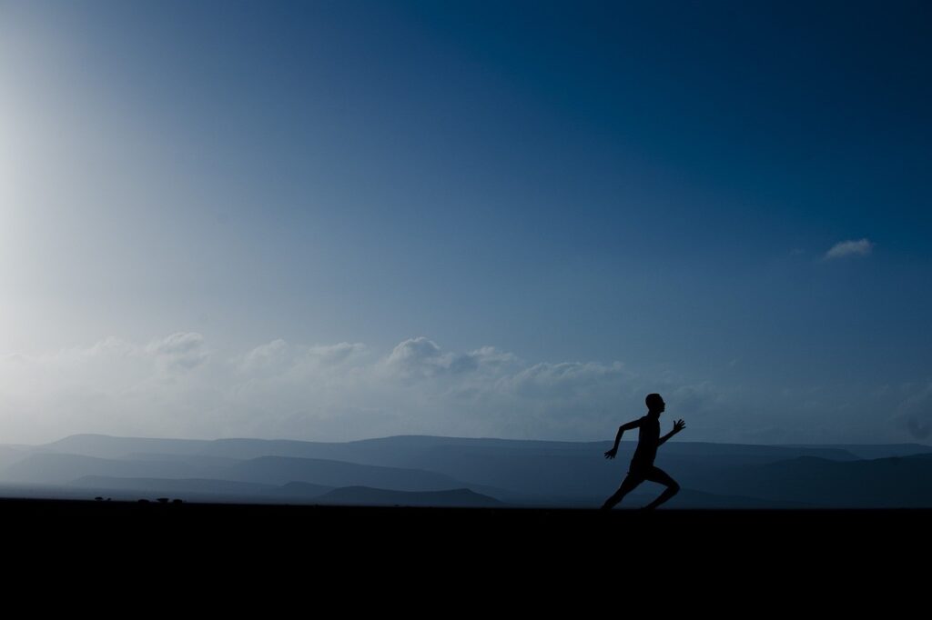 Man running at sunrise