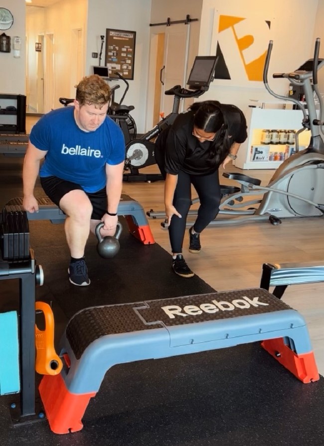 Pledge To Fitness Studio with a client working out with his personal training. Personal training is one of the pillars of Pledge To Fitness unique methodology.