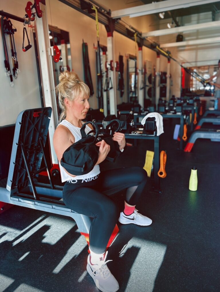 Female client working out at Pledge To Fitness Personal Training Studio in Bellaire, TX