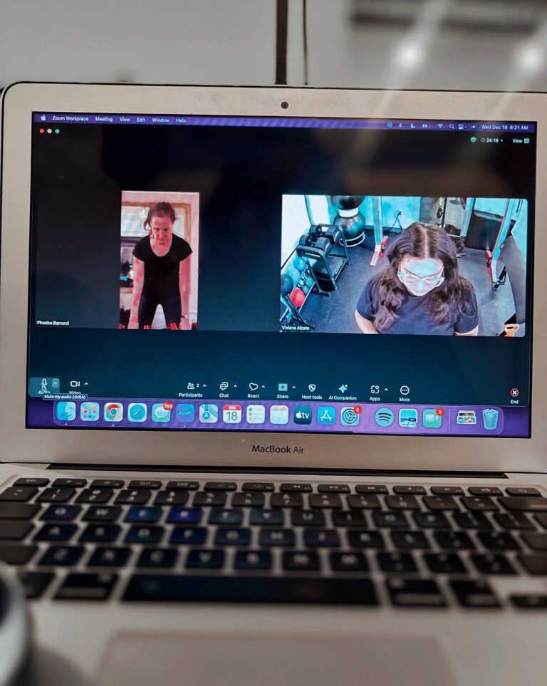 Client participating in an online fitness program led by a Pledge To Fitness® trainer during a virtual training session.