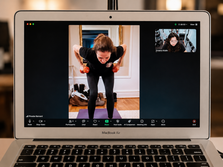 Live online personal training session showing a client performing strength exercises with a Pledge To Fitness coach.