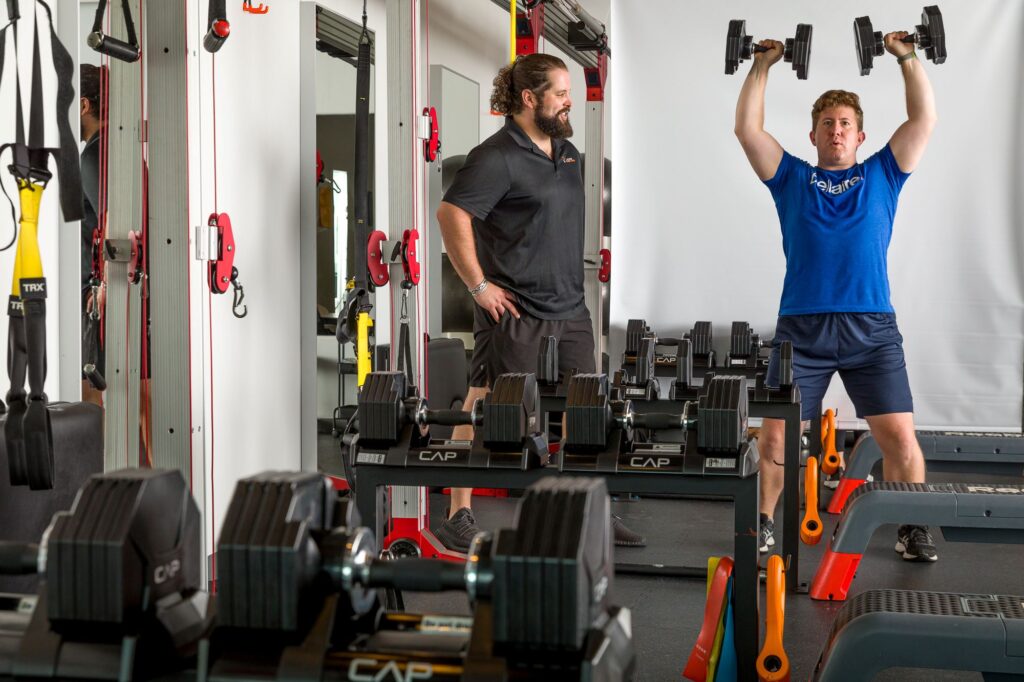A client training at Pledge To Fitness®'s boutique personal training and fitness studio in Bellaire, TX.