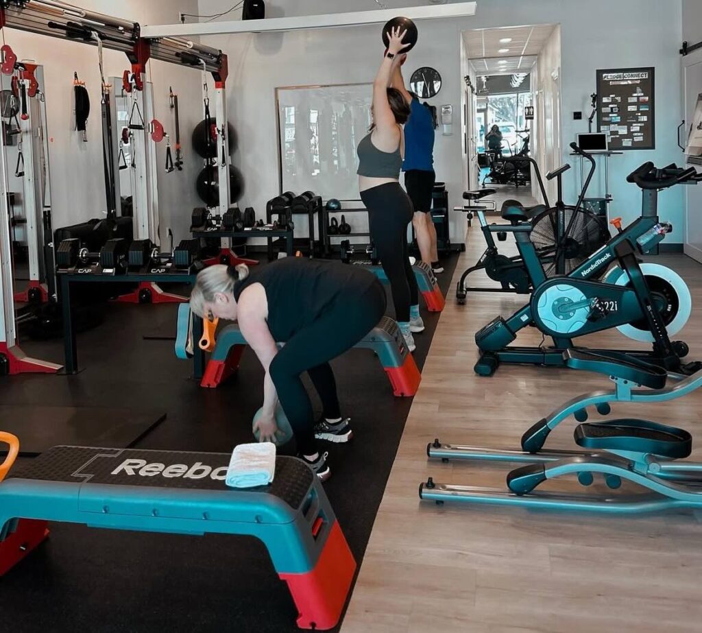 Clients training at Pledge To Fitness®, a Bellaire fitness studio in the heart of Houston