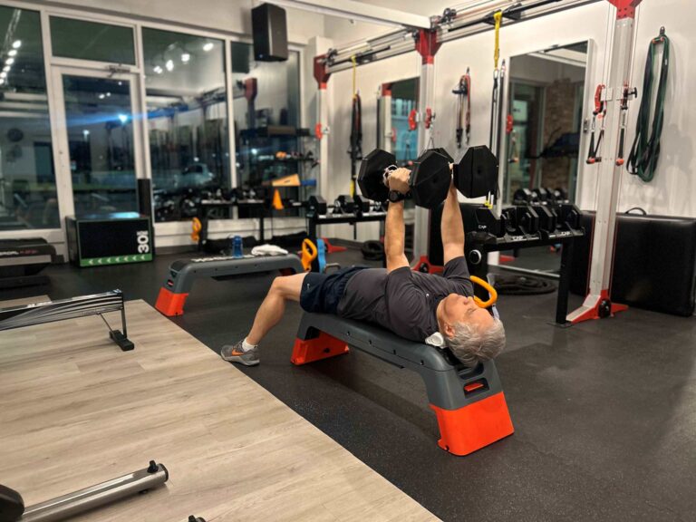 Dr. Moran, a fitness success story, training at the Pledge To Fitness® studio in Bellaire.