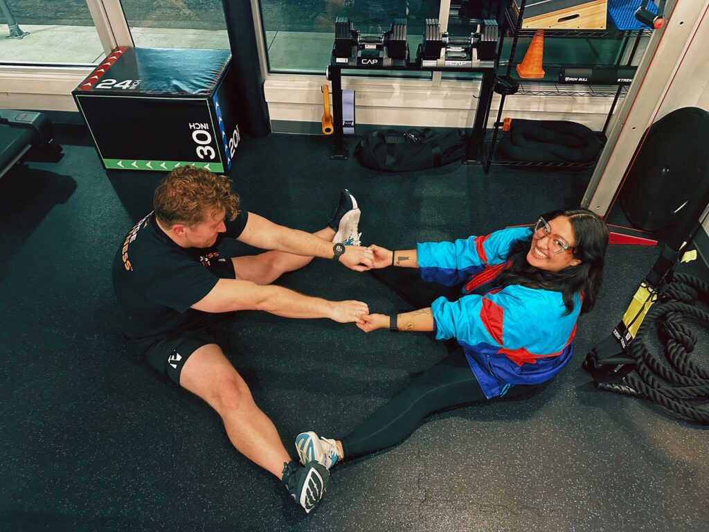 Personal trainer and client enjoying a personalized fitness session at Pledge To Fitness®.