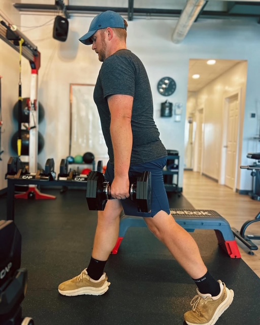 Flexible fitness for busy professionals: Dr. Collin Conrad performing a strength-training exercise at Pledge To Fitness.