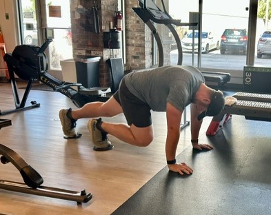 Dr. Collin Conrad performing a mountain climber exercise to improve conditioning and cardiovascular fitness.